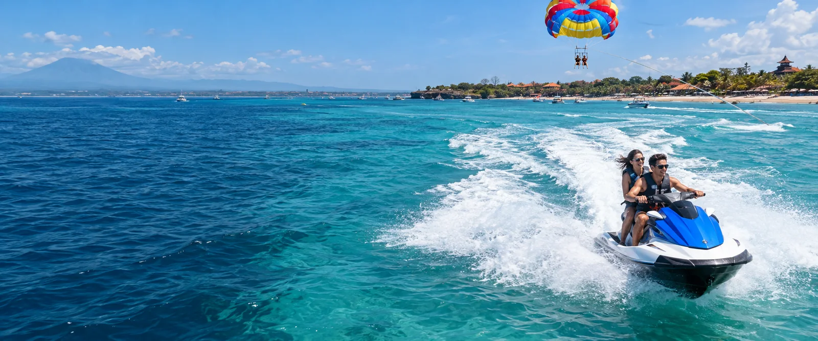 Jet ski and parasailing over turquoise water in Bali